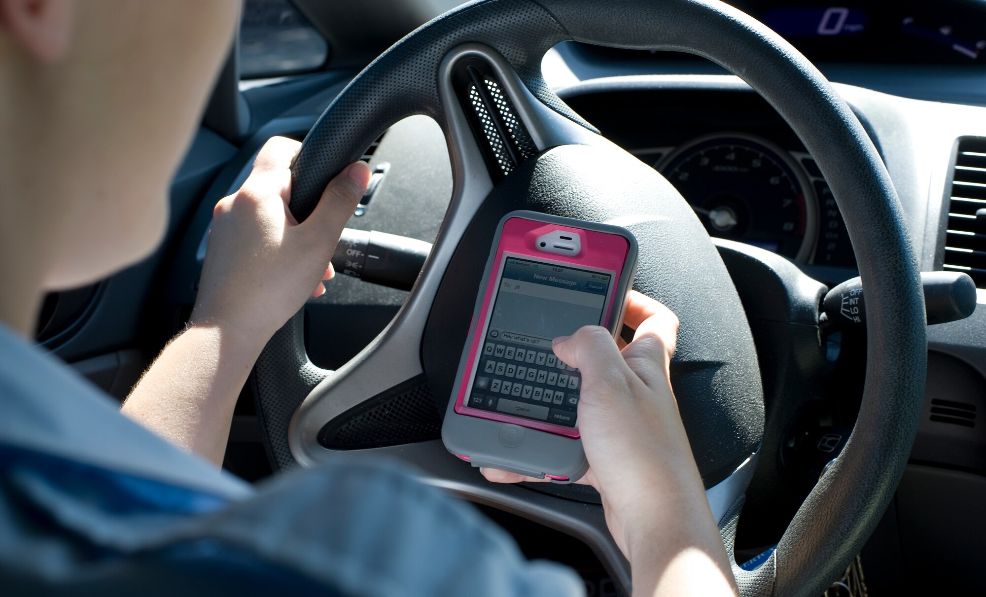 An Airman simulates texting and driving at Hurlburt Field, Fla., June 18, 2012. Cell phone usage while driving is prohibited on Department of Defense installations. (U.S. Air Force photo/Airman 1st Class Nigel Sandridge) (Released)
