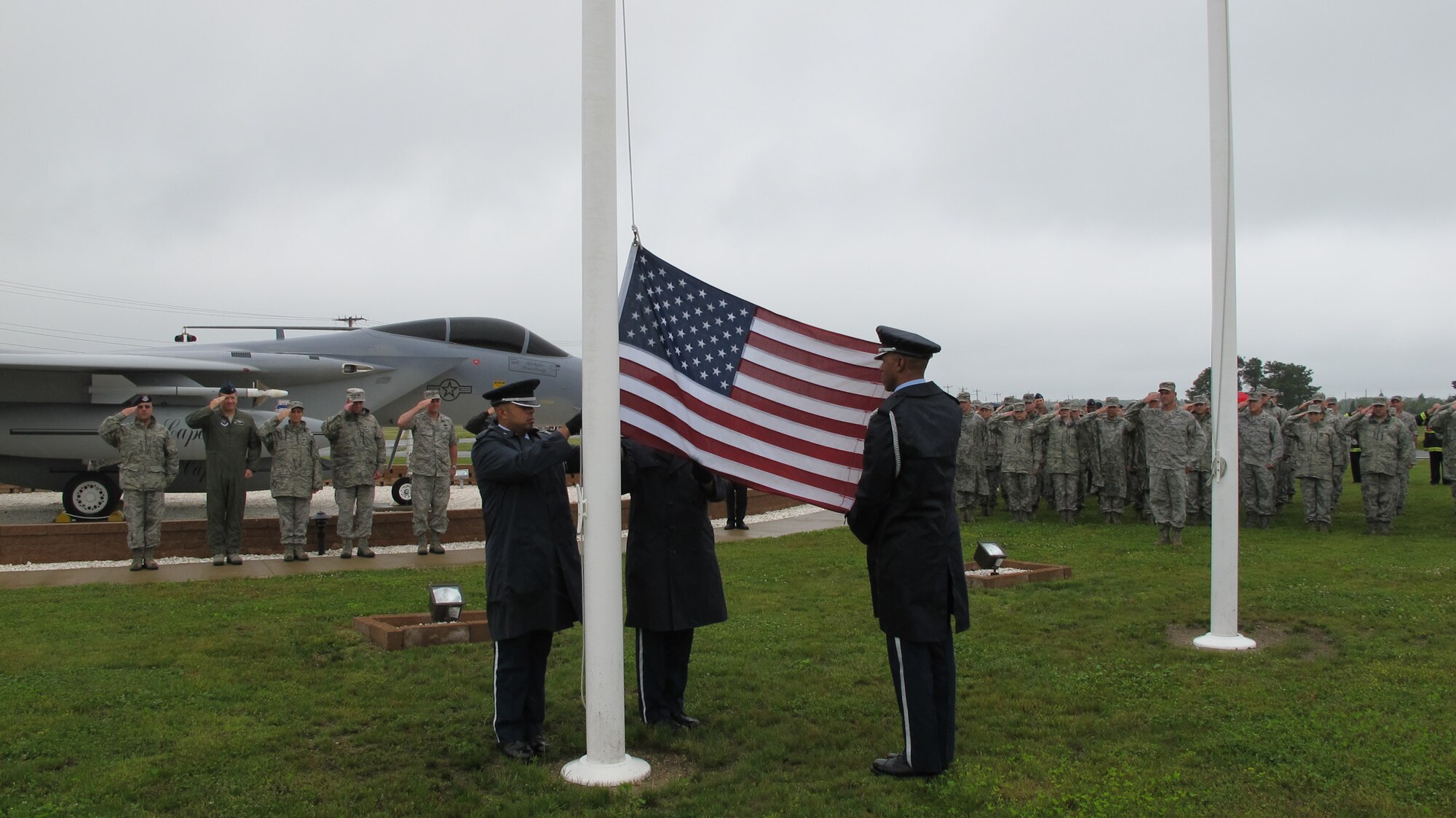 Members of the Otis Honor Guard raise an American flag June 13, 2012, at Otis Air National Guard Base, Mass.  The flag, which is traveling around the country as part of the Nation of Patriots' annual "Patriots Tour," was celebrated during a brief ceremony attended by members of the 102nd Intelligence Wing, Massachusetts Military Reservation firefighters and approximately 15 members of the Blackstone Valley Harley Owners Group chapter. (Air National Guard photo by Senior Airman Luiz Vicentini)