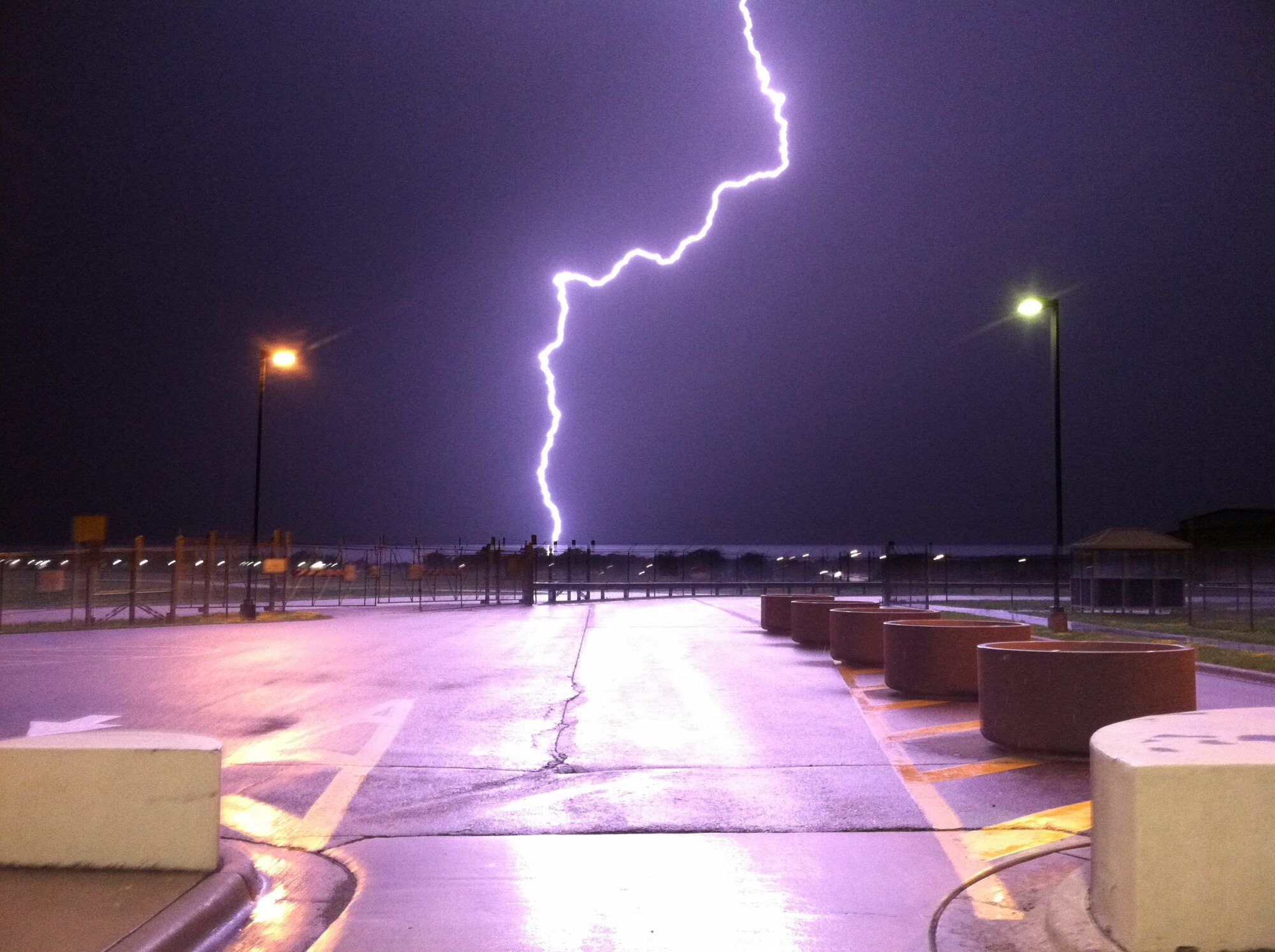 Early morning storms illuminate the the area outsite the main gate Tuesday at the Minneapolis-St. Paul Air Reserve Station.  (Air Force Photo/Senior Airman Jacob Rylander)