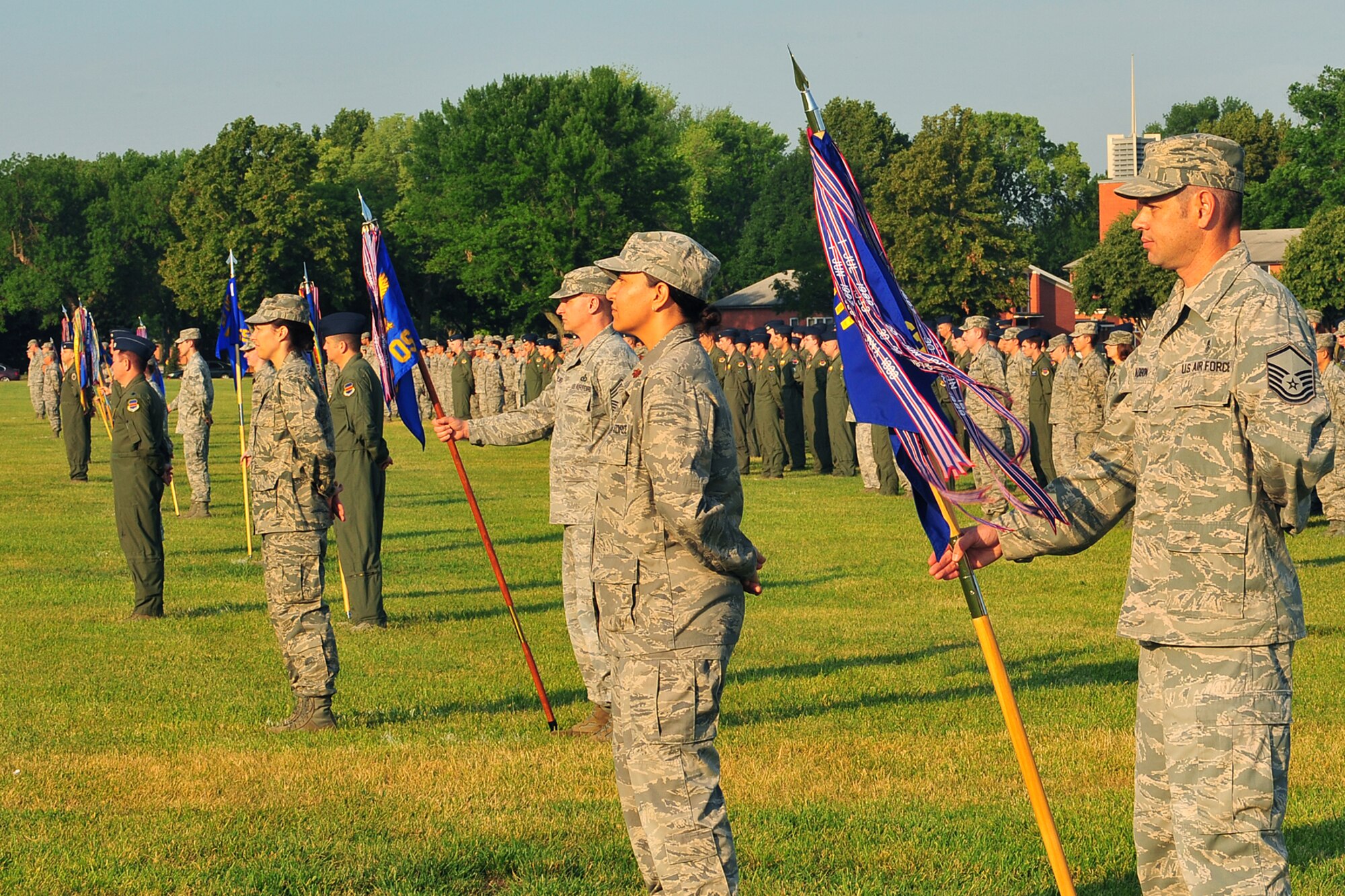 Team Offutt members stand at parade rest during the Flag Day ceremony held on the parade grounds at Offutt Air Force Base, Neb., June 14. On June 24, 1912 flags became standardized with specific proportions and the arrangement of the stars into six rows of eight each according to an executive order from President Taft.

(U.S. Air Force Photo by Charles Haymond/Released)