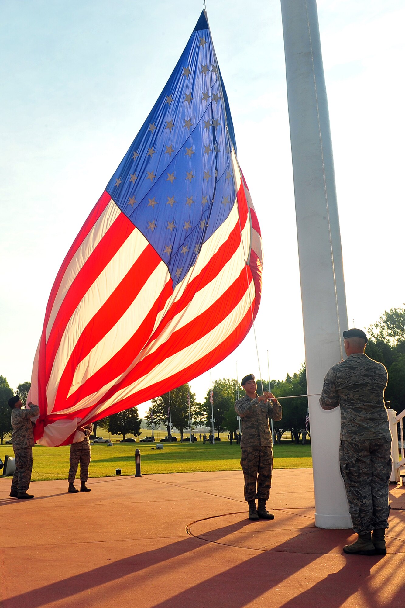 U.S. Air Force personnel from the 55th Security Forces Squadron lower the U.S. Flag during the Flag Day ceremony held on the parade grounds at Offutt Air Force Base, Neb., June 14. President Woodrow Wilson declared June 14 as the official date for National Flag Day in 1916. (U.S. Air Force Photo by Charles Haymond/Released.)