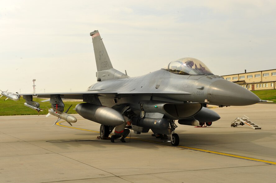 SPANGDAHLEM AIR BASE, Germany – Airman 1st Class Joshua Berard, 480th Aircraft Maintenance Unit crew chief, completes a standard aircraft launch procedure for an F-16 Fighting Falcon on Ramp 4 here June 19. The 480th AMU plays a vital role in supporting the F-16’s combat training mission, which prepares them for regional defense and air superiority. (U.S. Air Force photo by Airman 1st Class Dillon Davis/Released) 