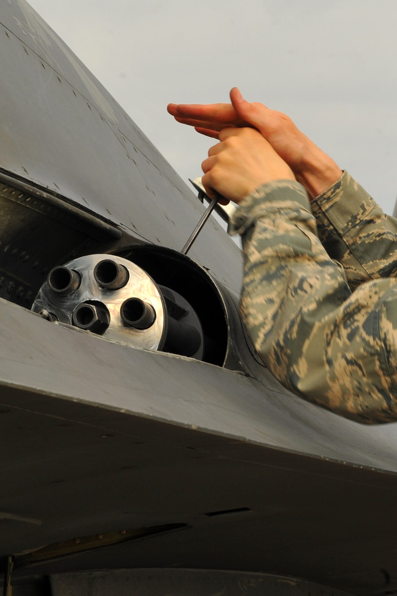 SPANGDAHLEM AIR BASE, Germany – Senior Airman Stephen Hoffler, 480th Aircraft Maintenance Unit weapons load crew member, puts a panel back onto an F-16 Fighting Falcon during mandatory 30 day gun-load maintenance on Ramp 4 here June 19. The 480th AMU plays a vital role in supporting the F-16’s combat training mission, which prepares pilots for regional defense and air superiority. (U.S. Air Force photo by Airman 1st Class Dillon/Released)