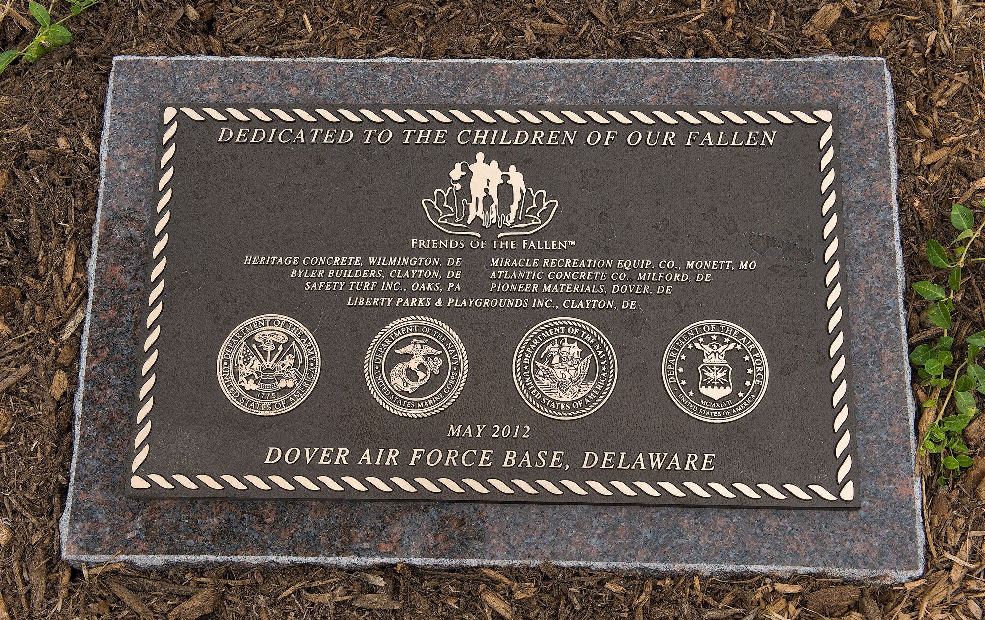 A plaque which reads: “Dedicated to the Children of the Families of the Fallen,” is displayed at the playground dedicated at the Fisher House for Families of the Fallen, Dover Air Force Base, Del., June 18, 2012. (U.S. Air Force photo/Roland Balik)
