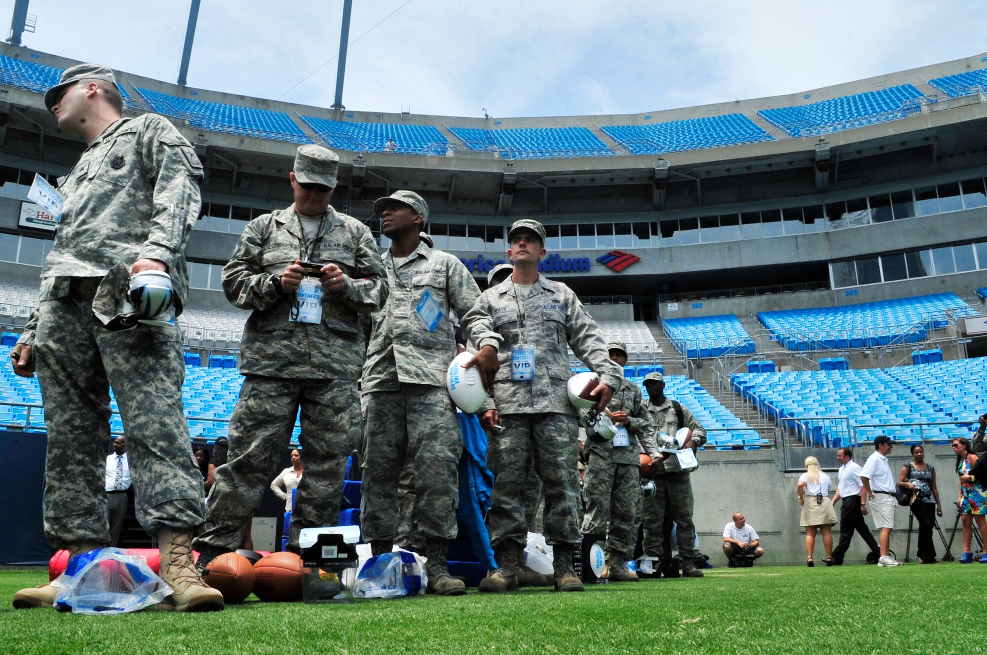 U.S. Air Force Airmen from Shaw Air Force base wait in line to receive autographs from the Carolina Panthers at the Bank of America Stadium, Charlotte, N.C., June 14, 2012. This event was to allow the public to watch the last Panthers minicamp training practice.(U.S. Air Force Airman Nicole Sikorski/Released)
