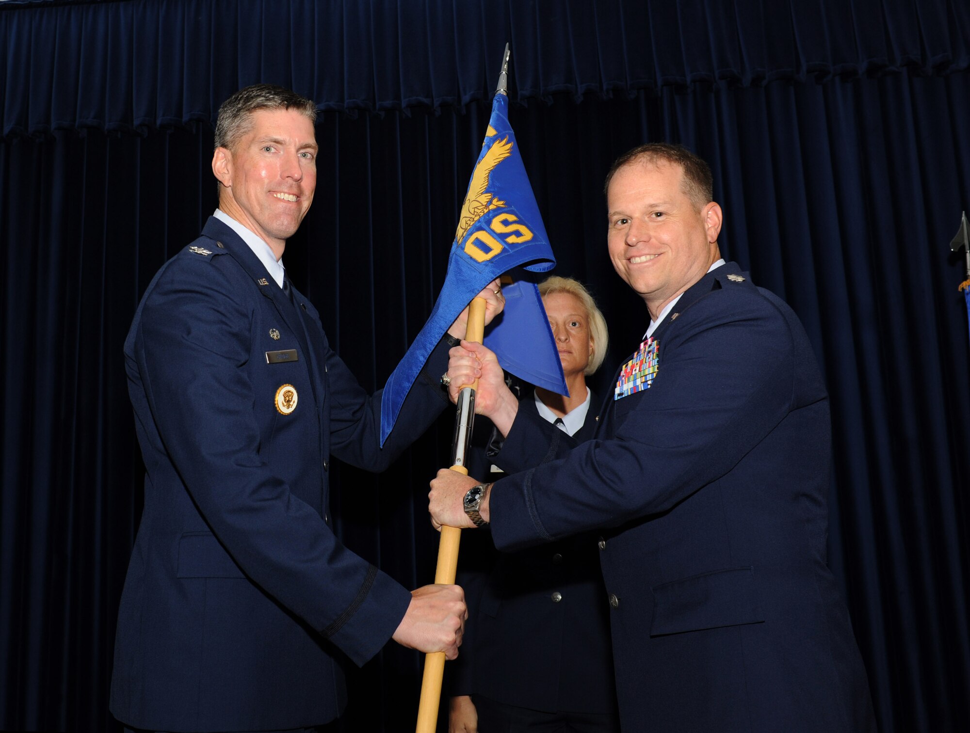Lt. Col. John Vincent, right, 39th Operations Squadron commander, accepts the squadron guidon from Col. Chris Craige, 39th Air Base Wing commander, during the 39th OS change-of-command ceremony June 19, 2012, at Incirlik Air Base, Turkey. Members of the 39th OS bid farewell to Lt. Col. Bryan Wolford and welcomed Lt. Col. John Vincent as their new squadron commander. (U.S. Air Force photo by Senior Airman Jarvie Z. Wallace/Released)
