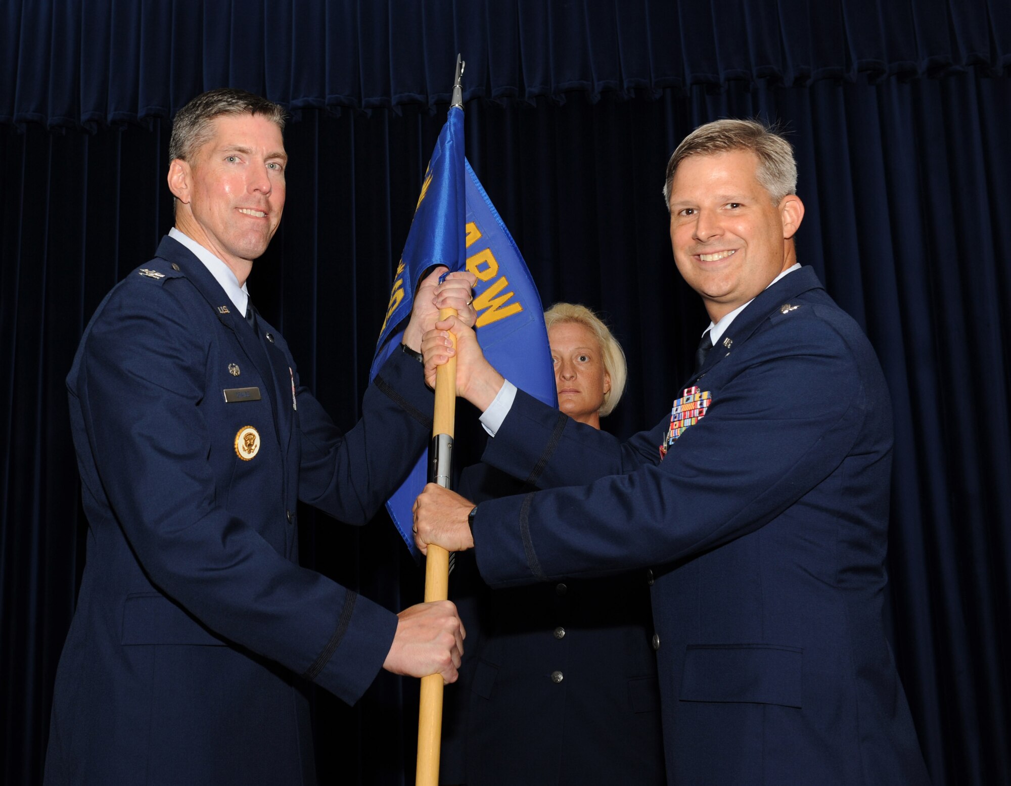 Lt. Col. Bryan Wolford, outgoing 39th Operations Squadron commander, relinquishes command of the 39th OS during the change-of-command ceremony June 19, 2012, at Incirlik Air Base, Turkey. Col Chris Craige, 39th Air Base Wing commander, was the presiding officer for the ceremony. (U.S. Air Force photo by Senior Airman Jarvie Z. Wallace/Released)