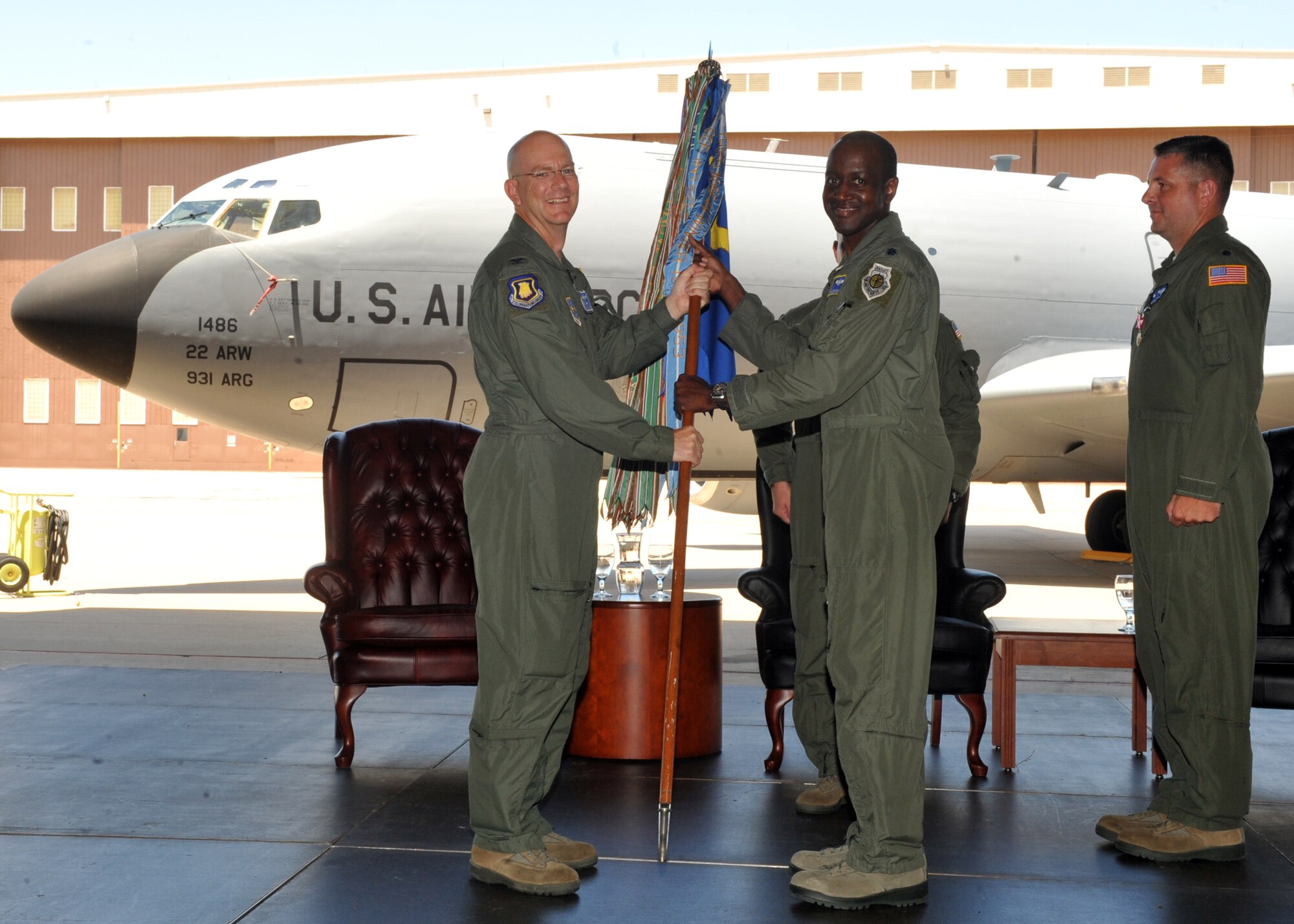 Col. Thomas Riney, 22nd Operations Group commander, passes the guidon to Lt. Col. Travis Edwards, 344th Air Refueling Squadron commander, during a change of command ceremony June 15, 2012, McConnell Air Force Base, Kan.  Edwards assumed authority and responsibility of the 344th ARS, which operates McConnell’s KC-135 Stratotankers and conducts aerial refueling missions. (U.S. Air Force photo/Airman 1st Class Maurice A. Hodges)