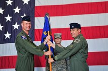 U.S. Air Force Col. James Sears, 20th Operations Group commander, and Lt. Col. Christopher Claus, 55th Fighter Squadron "Shooters" commander, pose for a photo as Claus assumes command at a change of command ceremony, Shaw Air Force Base, S.C., June 15, 2012. Claus assumed command in place of Lt. Col. Micheal Schnabel, prior 55th Fighter Squadron commander.(U.S. Air Force Airman Nicole Sikorski/Released)