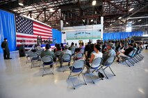 U.S. Air Force Col. James Sears, 20th Operations Group commander, welcomes the new 55th Fighter Squadron "Shooters" commander, Lt. Col. Christopher Claus at the change of command ceremony, Shaw Air Force Base, S.C., June15 2012. Claus assumed command in place of Lt. Col. Micheal Schnabel, 55th Fighter Squadron prior commander.(U.S. Air Force Airman Nicole Sikorski/Released)