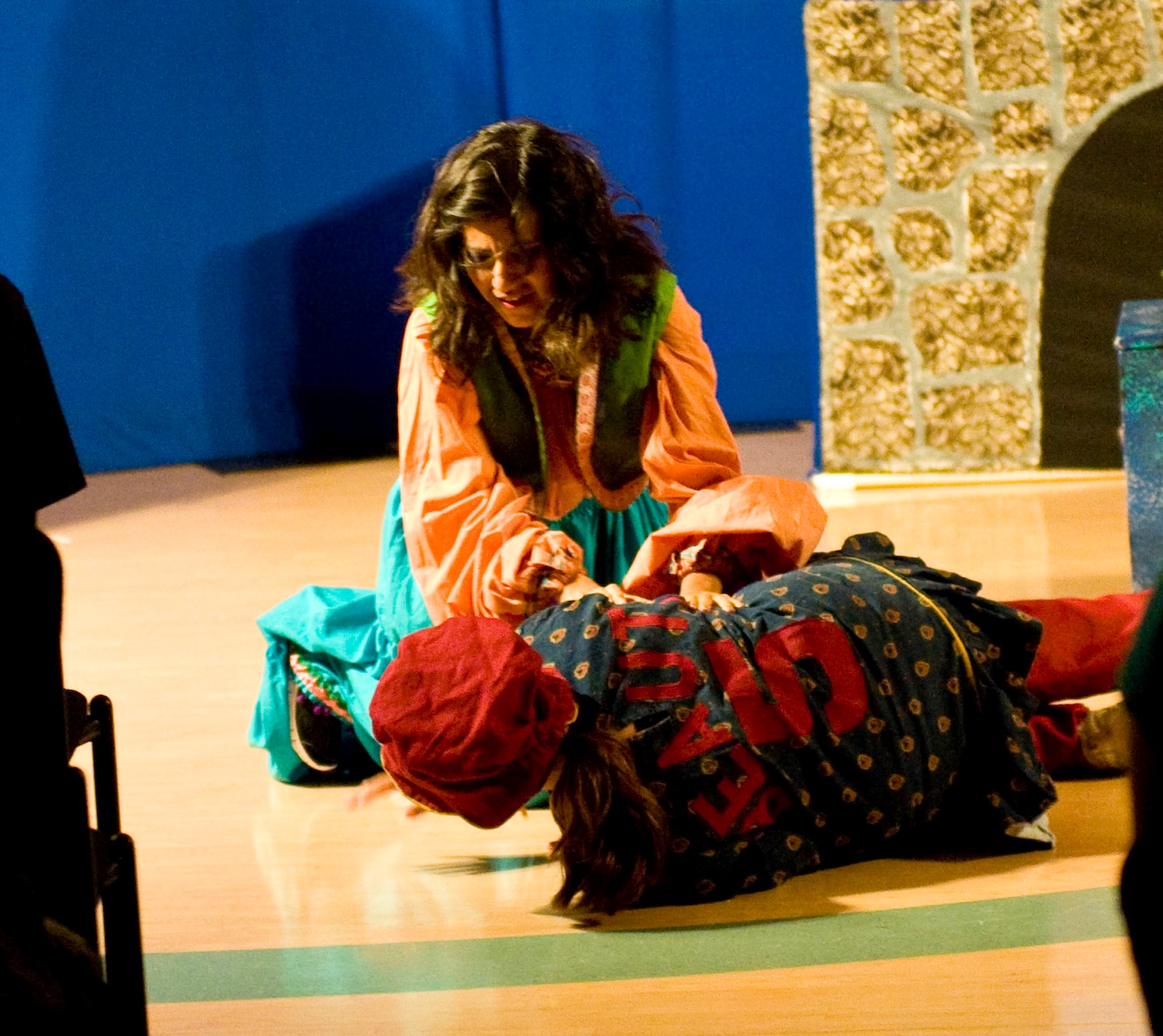 Lovely and Beauty, the "ugly stepsisters," fight during a performance of "Cinderella" June 16, 2012, at the Youth Center on Dover Air Force Base, Del. The play, produced by the Missoula Children's Theatre, was a twist on the traditional tale of "Cinderella." (U.S. Air Force photo by Senior Airman Matthew Hubby)