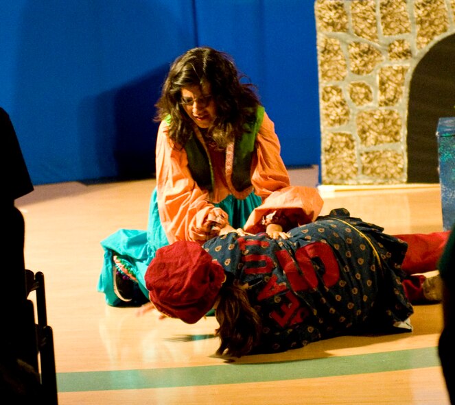 Lovely and Beauty, the "ugly stepsisters," fight during a performance of "Cinderella" June 16, 2012, at the Youth Center on Dover Air Force Base, Del. The play, produced by the Missoula Children's Theatre, was a twist on the traditional tale of "Cinderella." (U.S. Air Force photo by Senior Airman Matthew Hubby)