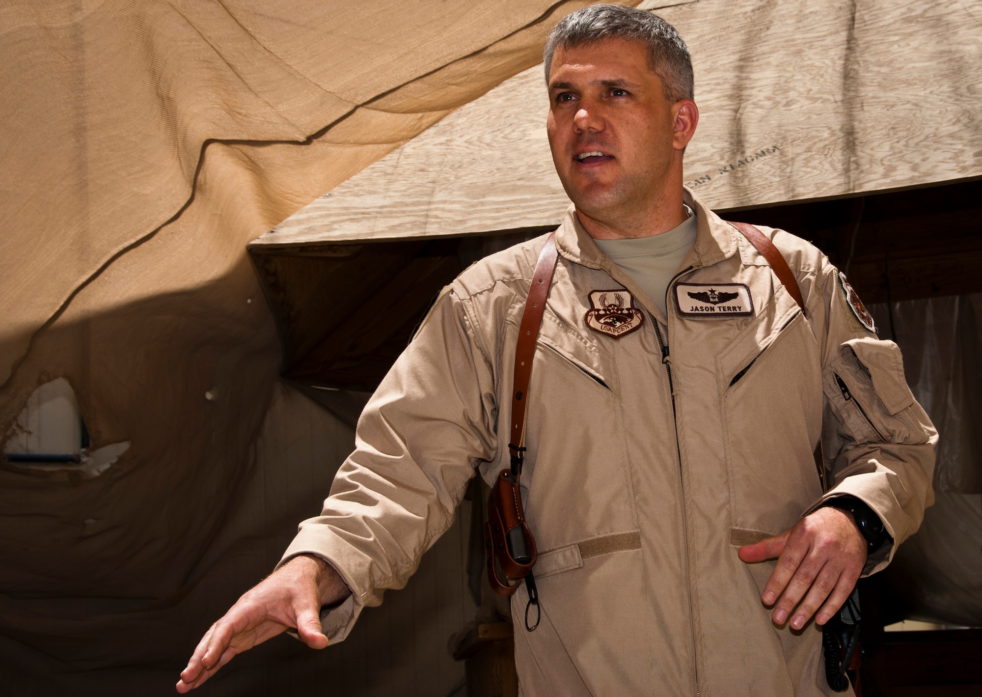Lt. Col. Jason Terry, 52nd Airlift Squadron Director of Operations, addresses his Airmen as 455th deputy Operations Group commander, at Bagram Airfield, Afghanistan, during a brief celebration honoring their unit’s 70th Anniversary while deployed in support of Operation Enduring Freedom. (U.S. Air Force photo/TSgt Shawn McCowan)