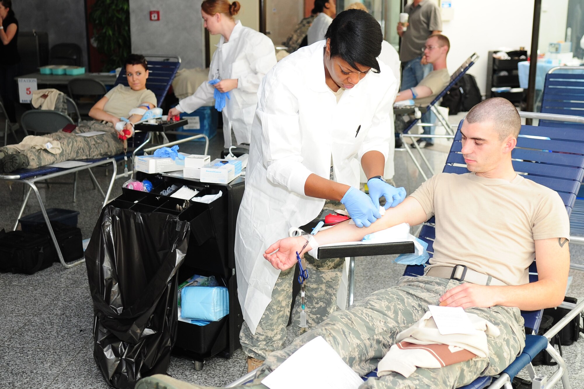 Airmen give blood during a unit-run blood drive at the Hercules Theater at Ramstein Air Base, Germany, June 19. On average these blood drives collect about 30 units of blood. Every donation could possibly save a life. (U.S. Air Force photo/Tech. Sgt. Chad Thompson)