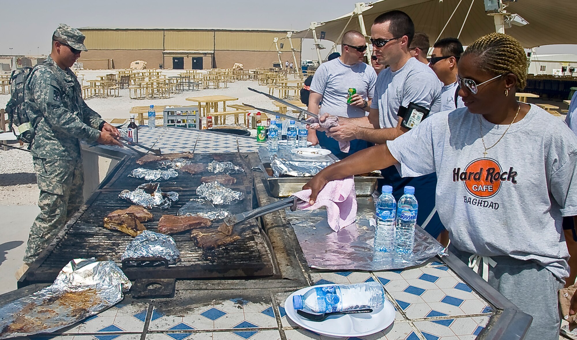 SOUTHWEST ASIA - Service members made the most of their deployed Father’s Day as many marinated and grilled their own T-bone steaks here June 17. The 379th Air Expeditionary Wing provided home-comfort activities to deployed service members who are supporting ongoing contingency operations in Southwest Asia. (U.S. Air Force photo/Senior Airman Bryan Swink)