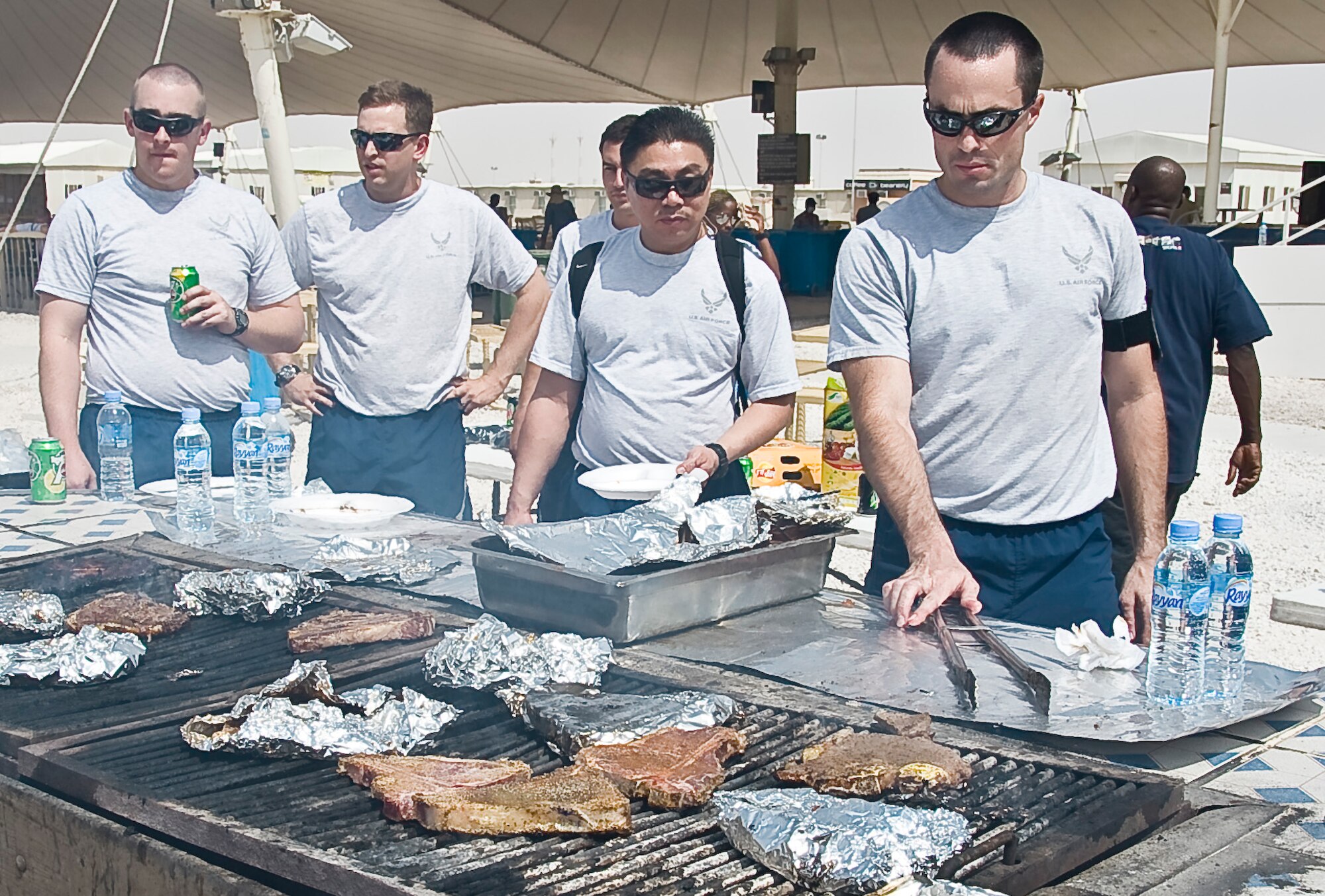 SOUTHWEST ASIA - Service members made the most of their deployed Father’s Day as many marinated and grilled their own T-bone steaks here June 17. The 379th Air Expeditionary Wing provided home-comfort activities to deployed service members who are supporting ongoing contingency operations in Southwest Asia. (U.S. Air Force photo/Senior Airman Bryan Swink)