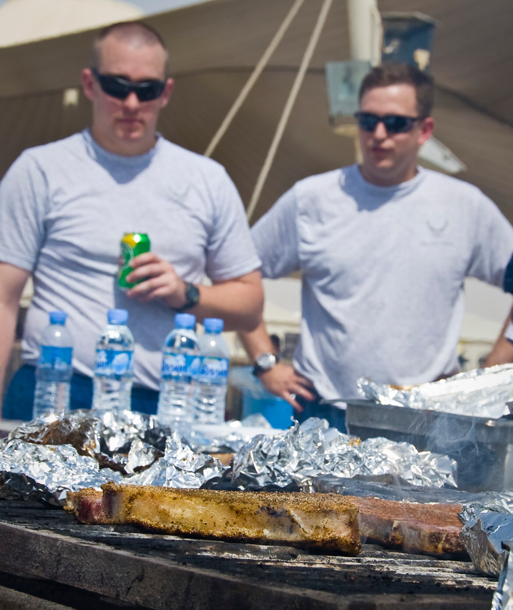 SOUTHWEST ASIA - Service members made the most of their deployed Father’s Day as many marinated and grilled their own T-bone steaks here June 17. The 379th Air Expeditionary Wing provided home-comfort activities to deployed service members who are supporting ongoing contingency operations in Southwest Asia. (U.S. Air Force photo/Senior Airman Bryan Swink)