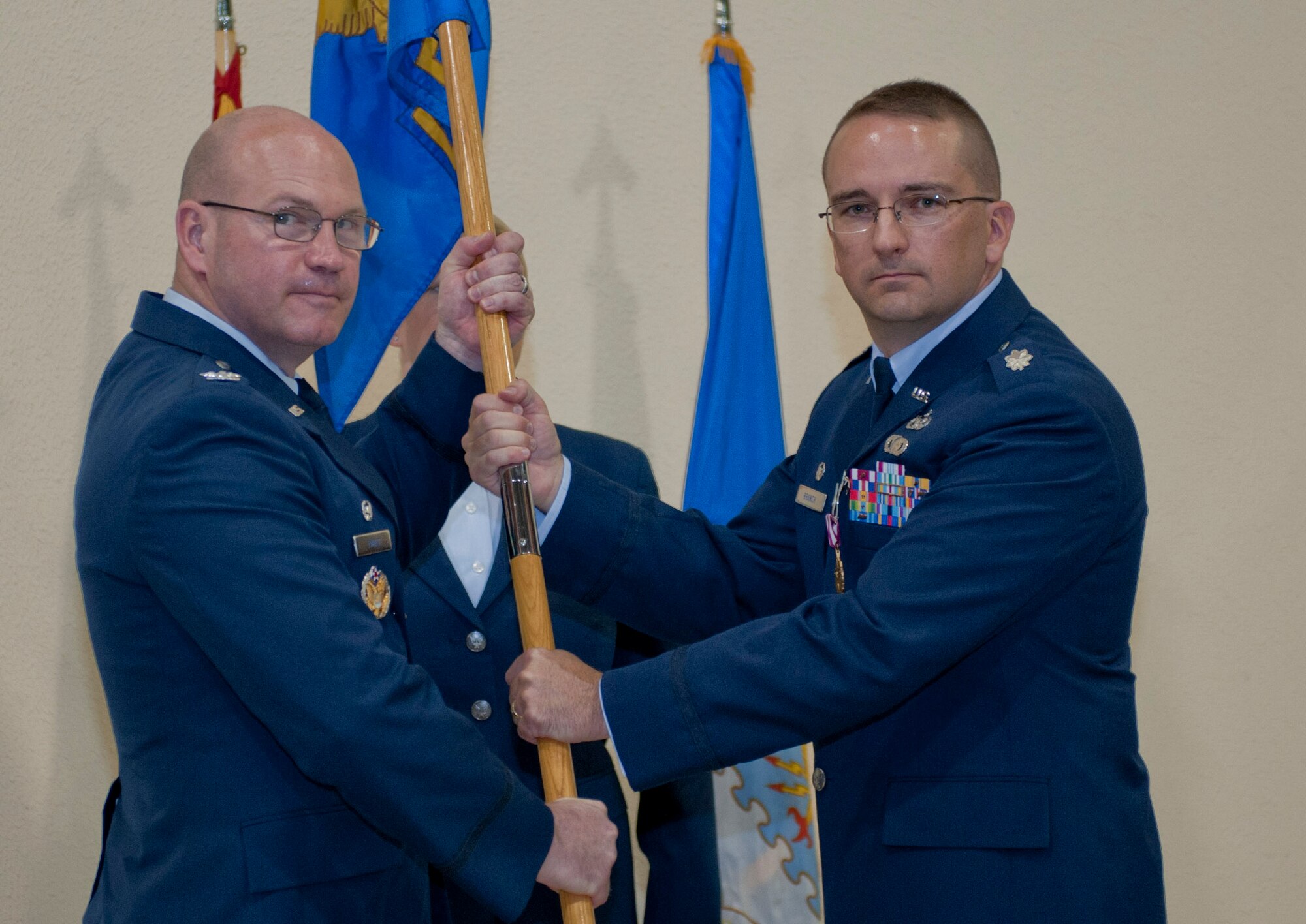 Lt. Col. Jason Branch, outgoing 39th Logistics Readiness Squadron commander, relinquishes command of the 39th LRS to Col. Scott Enold, 39th Mission Support Group commander, during the change-of-command ceremony June 19, 2012 at Incirlik Air Base, Turkey. Branch will be replaced by Maj. James Gherdovich. (U.S. Air Force photo by Senior Airman Anthony Sanchelli/Released) 