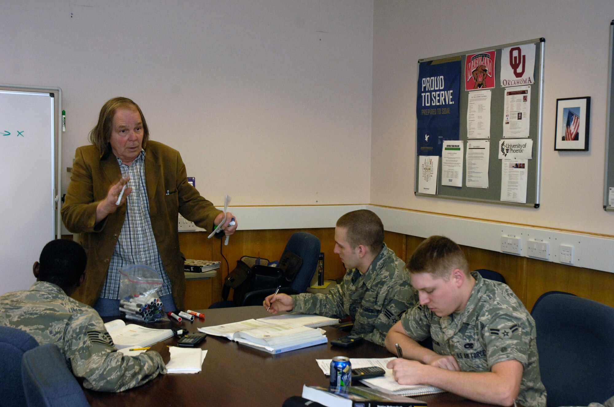 ROYAL AIR FORCE LAKENHEATH, England - Michael Mason, University of Maryland University College Associate Professor, teaches basic college math on-site to Airmen from the 48th Component Maintenance Squadron June 14, 2012. The class is held in the Hardened Avionics Facility and runs from 12:15 to 1:30 p.m. Monday through Thursday, giving Airmen the opportunity to attend class without leaving their work area. (U.S. Air Force photo by Senior Airman Erin Mills)