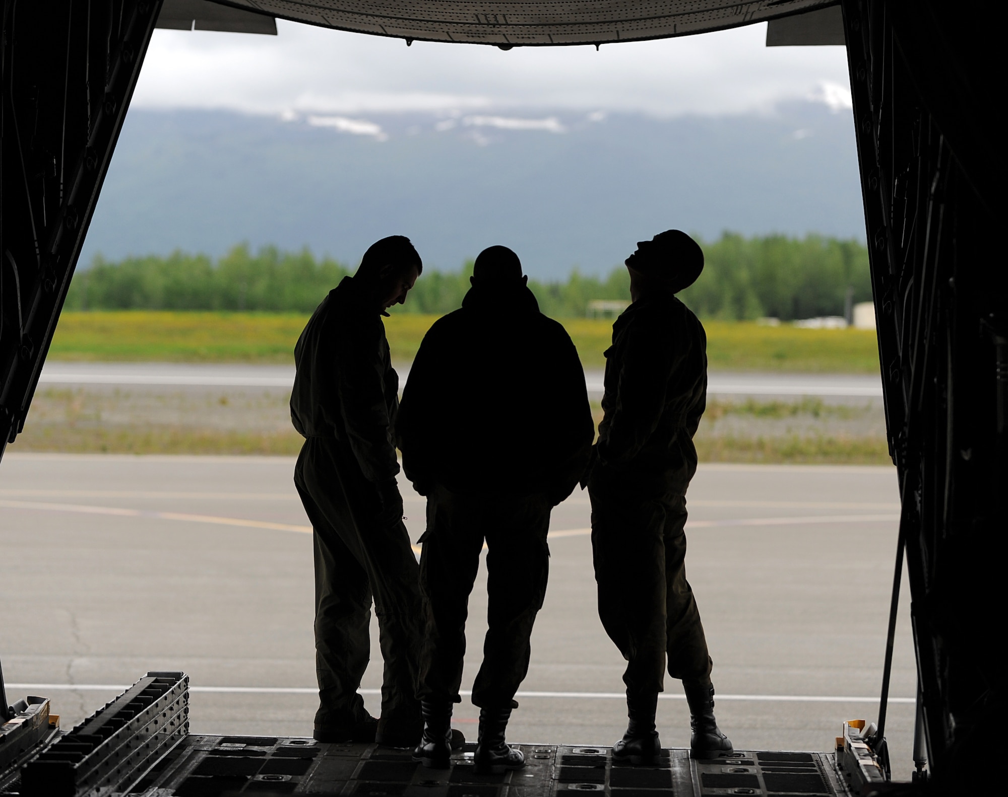 Members of the Polish Air Force C-130 Hercules crew inspect the aircraft during Red Flag-Alaska on Joint Base Elmendorf-Richardson June 13, 2012. The goal of Red Flag-Alaska is to provide each aircrew with vital first missions to increase their chances of survival in combat environments.