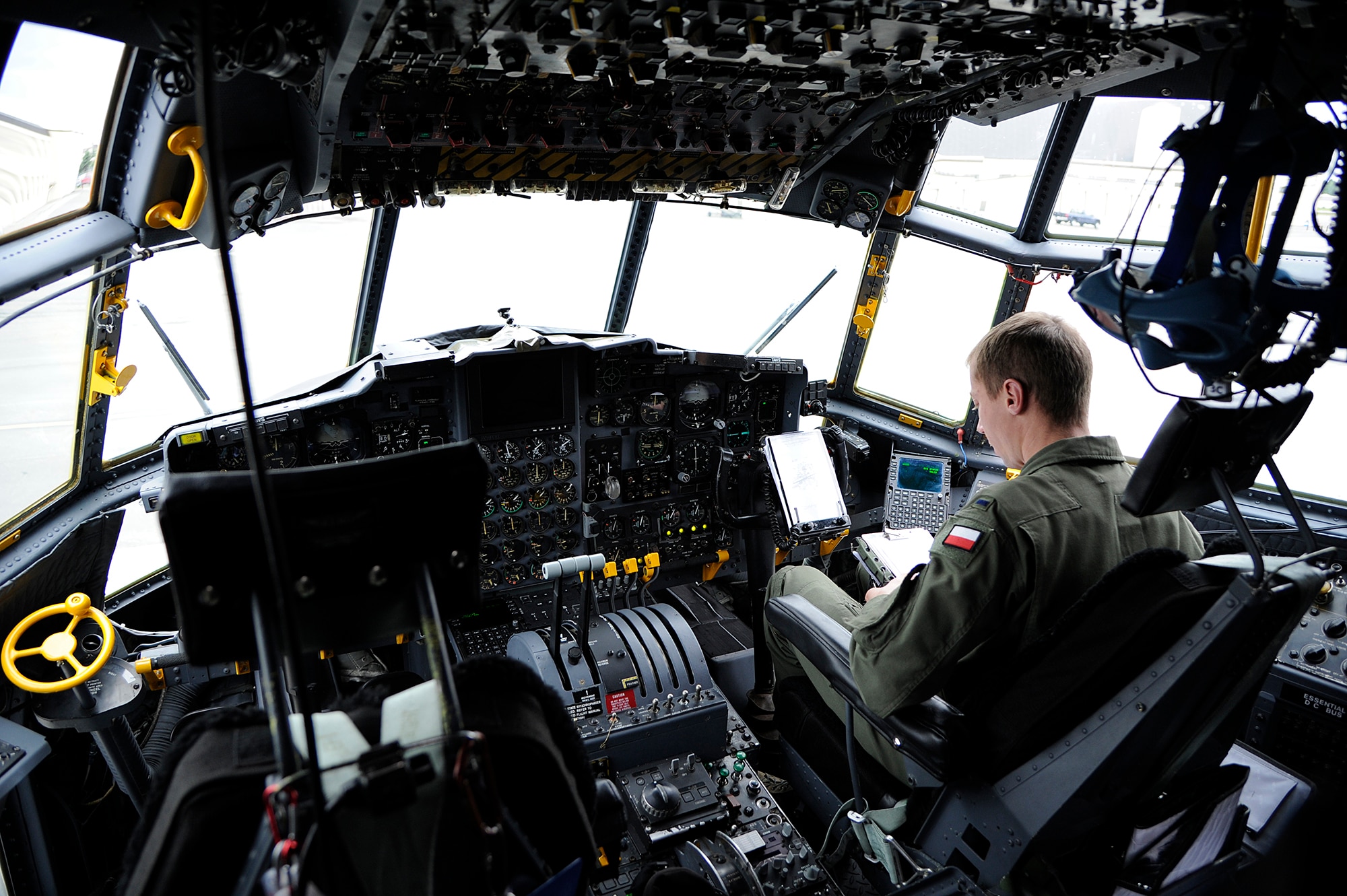Polish air force 1st Lt. Tomasz Kozlowski, C-130 Hercules co-pilot, performs a preflight inspection during Red Flag-Alaska on Joint Base Elmendorf-Richardson, Alaska, June 13, 2012. The goal of Red Flag-Alaska is to provide each aircrew with vital first missions to increase their chances of survival in combat environments.