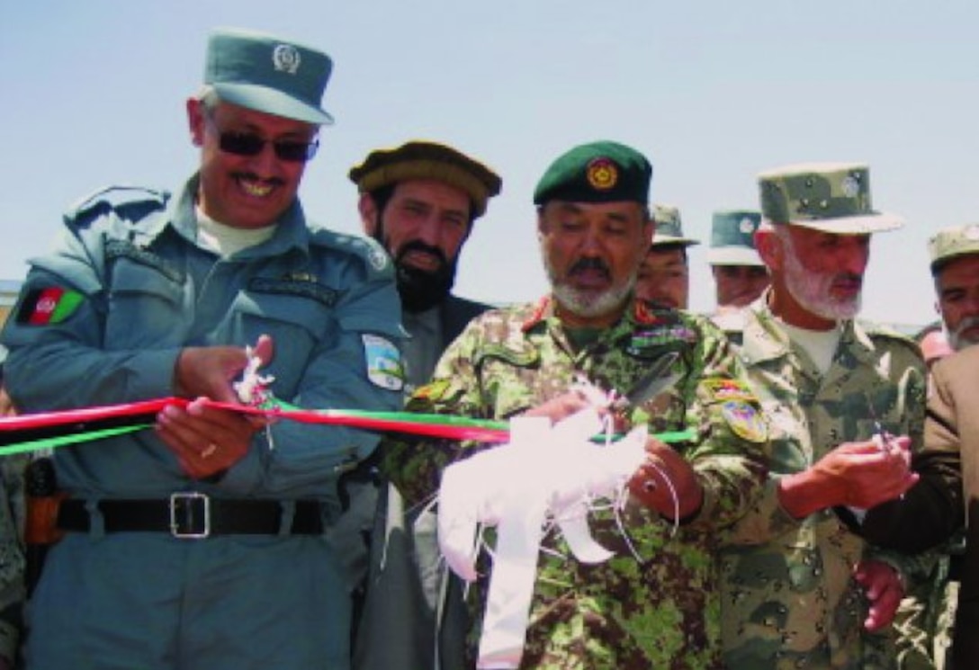 Afghanistan National Police, civic and provincial leaders recently commemorate the transfer of the Border Police Zone Command station at Gardez in Paktya Province with a ribbon-cutting ceremony.