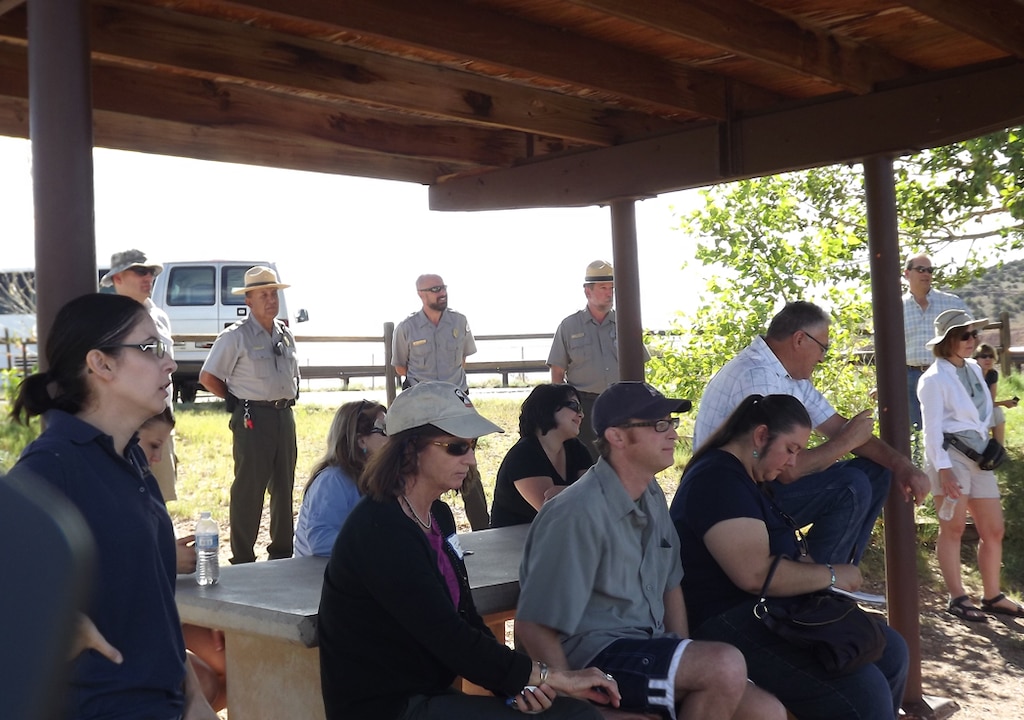 After introductions and an explanation of the Middle Rio Grande Collaborative Program and Rio Grande Water Compact, the physical tour began on Day two at the Corps' Abiquiu Lake Project.The first stop was Abiquiu’s Diversion Outlook where participants heard a presentation by Mr. Fred Vigil, Director of the Rio Chama Acequia Association.  
