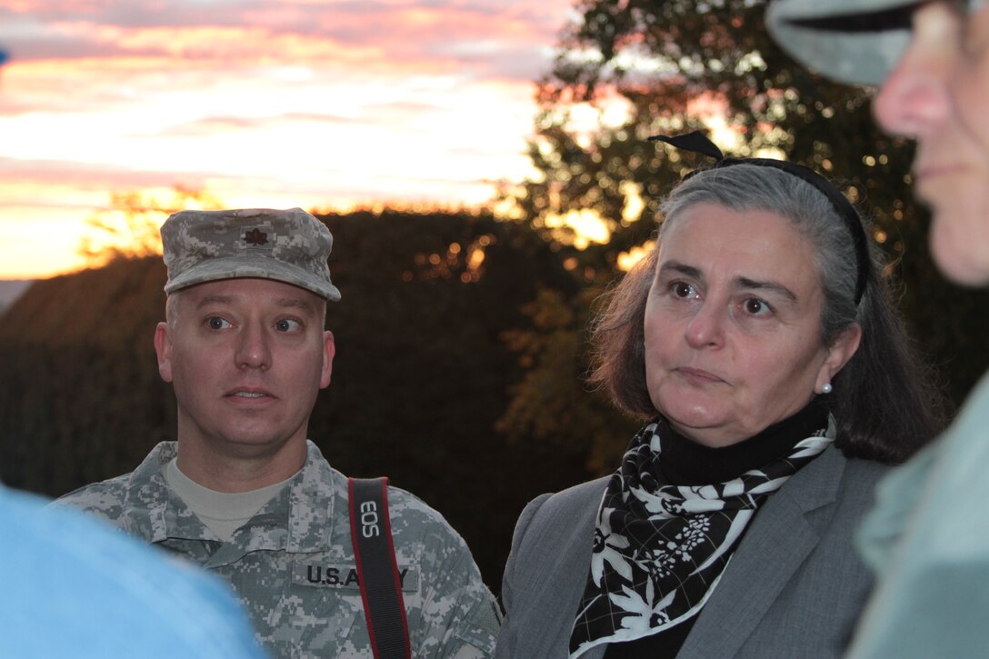 Lt. Col. David Fedroff, Norfolk District, U.S. Army Corps of Engineers deputy commander and Kathryn A. Condon, Arlington National Cemetery’s executive director, listen to feedback from experts about repairs made to the Tomb of the Unknowns. Norfolk District and the cemetery invited experts to the tomb Oct. 21, 2011 to inspect repairs made to cracks in the tomb's stone. (U.S. Army photo/Kerry Solan)