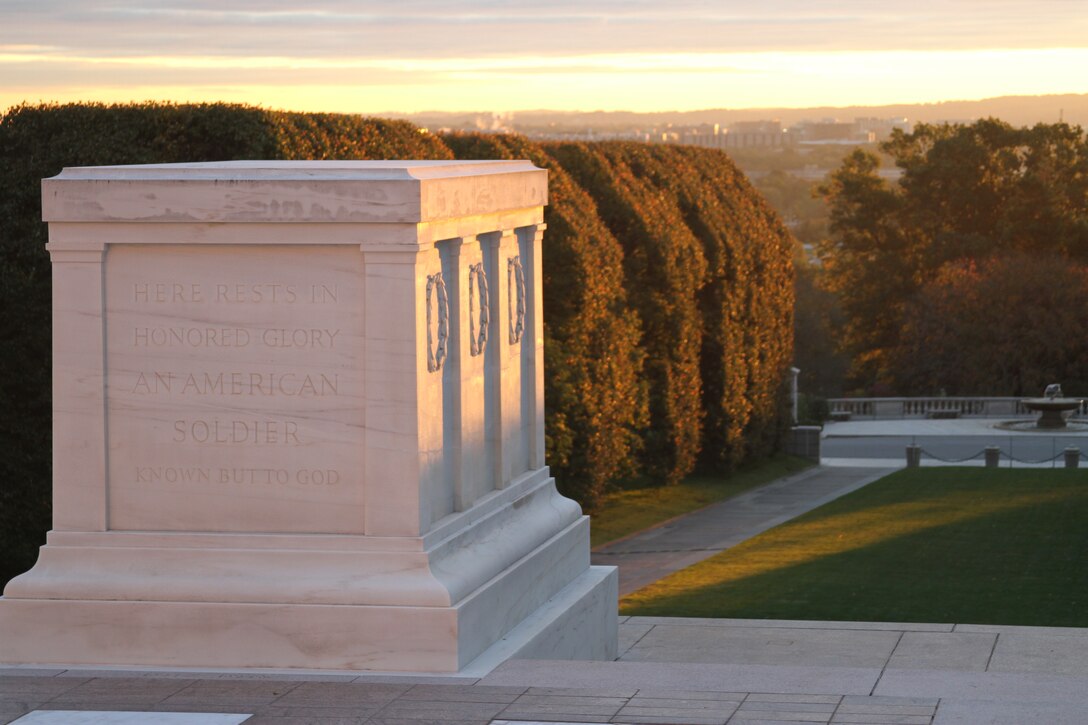The Tomb of the Unknowns glows at dawn Oct. 21, 2011 at Arlington National Cemetery. Experts gathered at the tomb that morning to inspect repairs made to cracks in the tomb. (U.S. Army photo/Kerry Solan)