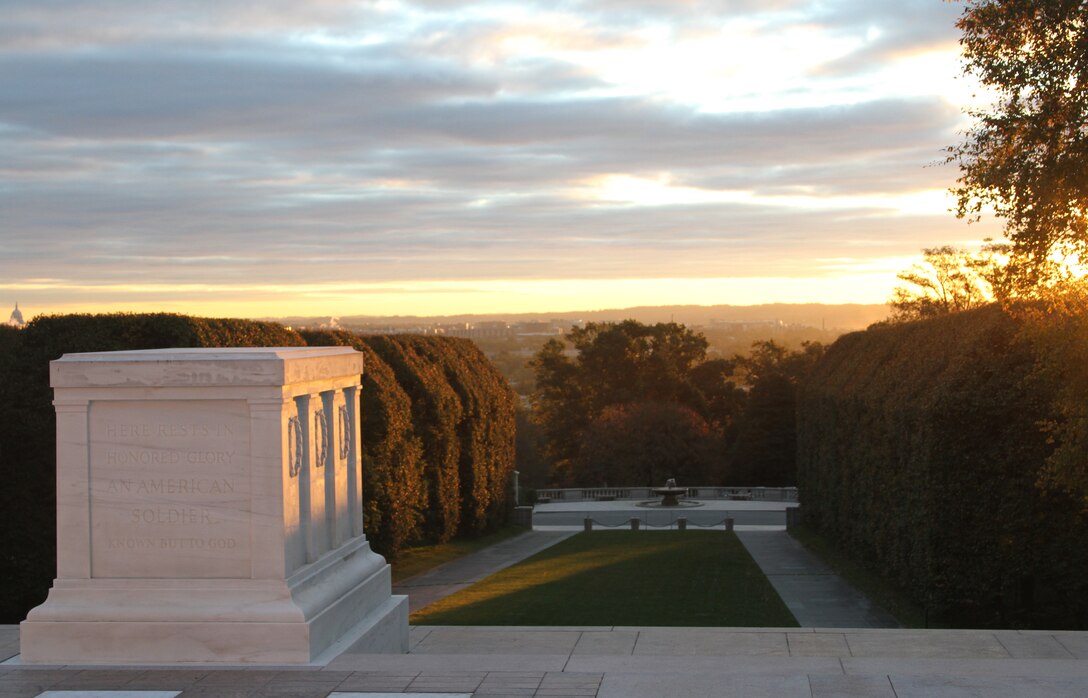 The Tomb of the Unknowns glows at dawn Oct. 21, 2011 at Arlington National Cemetery. Experts gathered at the tomb that morning to inspect repairs made to cracks in the tomb. (U.S. Army photo/Kerry Solan)