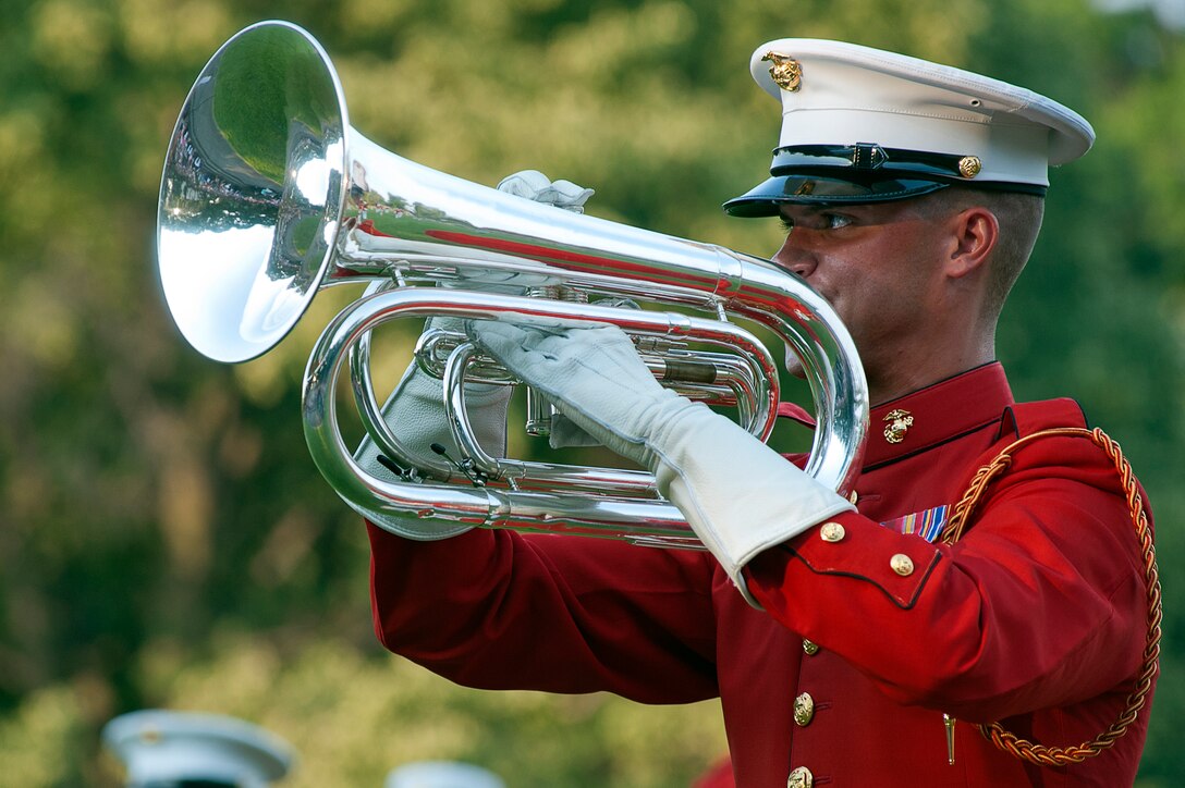 Sgt. David Cox, U.S. Marine Drum & Bugle Corps baritone player, performs a solo during the D&B's performance at a Sunset Parade at the Marine Corps War Memorial June 19.