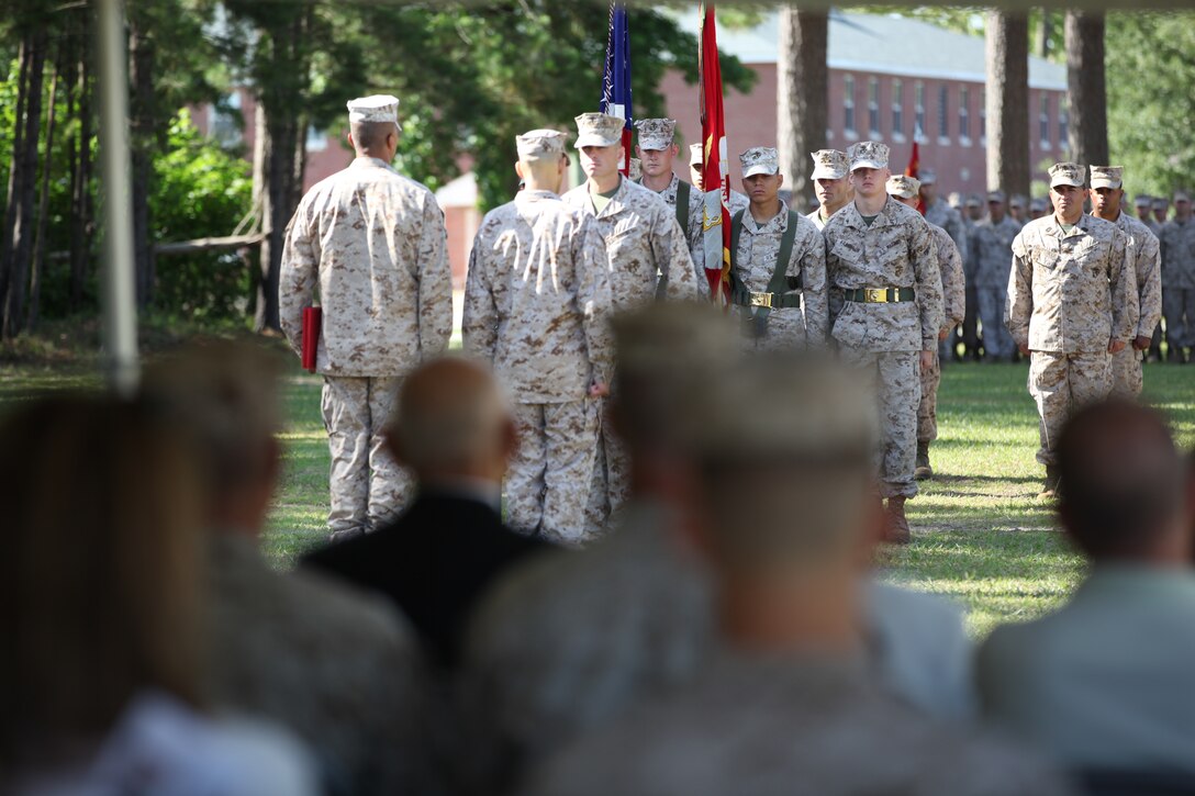 Guests observe as Lt. Col. Ivan I. Monclova is awarded for his service as the commanding officer of Weapons Training Battalion, Marine Corps Installations East – Marine Corps Base Camp Lejeune during a change of command ceremony at Stone Bay June 15. Monclova relinquished command as commanding officer of WTBN to Lt. Col. Carlos A. Vallejo.