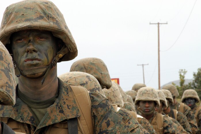 Pfc. Thomas S. Breiter, Platoon 1073, Company D, 1st Recruit Training Battalion, awaits improvised explosive device training alongside fellow Marines during the Crucible at Marine Corps Base Camp Pendleton, CA, June 12. Breiter chose to enlist into the Marines as military police, the same military occupational specialty as his mother. Breiter explained his choice to choose the Marine Corps over other military branches was highly influenced by his mother and father's service in the Corps.