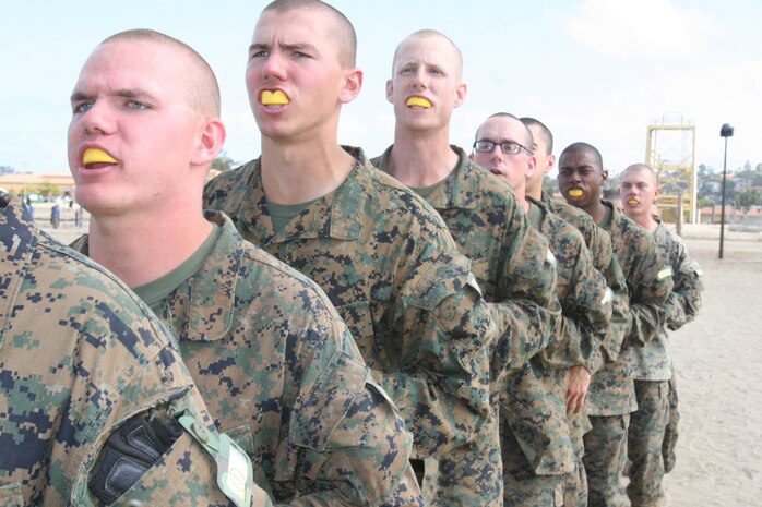 Recruits run in place to warm up while they wait to begin a pugil stick bout June 5 aboard Marine Corps Recruit Depot San Diego. This is the third pugil sticks Company H has had the chance of doing since arriving on the depot. Each pugil sticks session is different and done in various enviroments ensuring recruits are ready for close-combat situations if ever deployed.