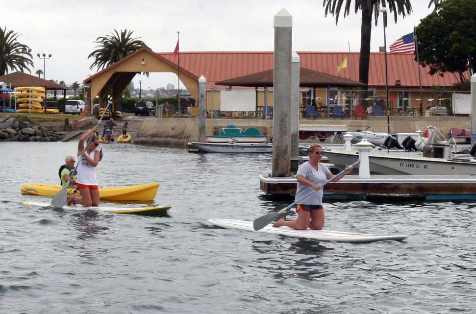 Military families paddle out using the four hours of free boating equipment provided by the Boat House Recreation Center during Fish or Boat with Dad Day June 16 aboard Marine Corps Recruit Depot San Diego. The event lasted from 7:30 a.m to 4 p.m. and included a free lunch of hot dogs, hamburgers and soda. The annual event has been taking place aboard MCRD since 1995.  