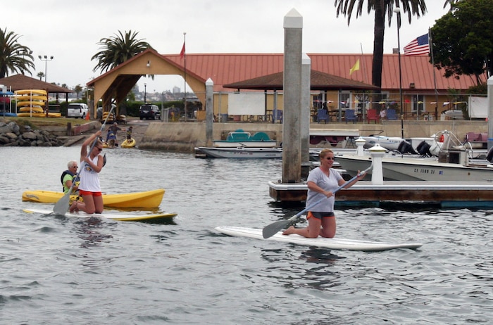 Military families paddle out using the four hours of free boating equipment provided by the Boat House Recreation Center during Fish or Boat with Dad Day June 16 aboard Marine Corps Recruit Depot San Diego. The event lasted from 7:30 a.m to 4 p.m. and included a free lunch of hot dogs, hamburgers and soda. The annual event has been taking place aboard MCRD since 1995.  