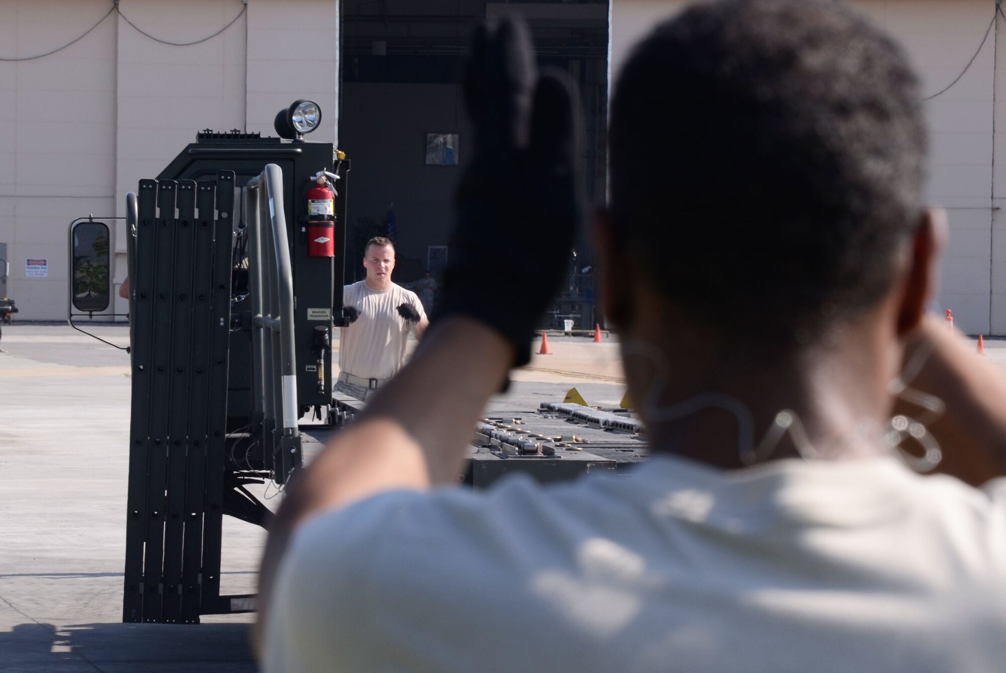 Team work prevails as members of the 80th Aerial Port Squadron compete in the 25K loader event during the Air Force Reserve Command Port Dawg Challenge at Dobbins Air Reserve Base, Ga., June 19-21. (U.S. Air Force photo/Don Peek)