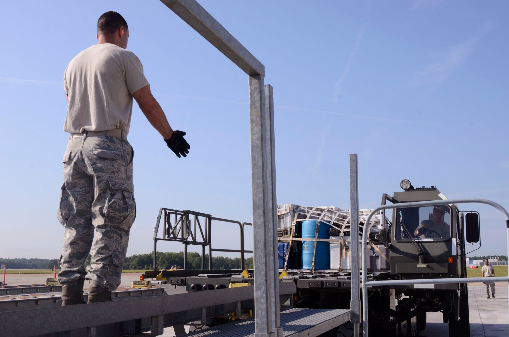 Members of the 80th Aerial Port Squadron compete in the 25K loader event during the Air Force Reserve Command Port Dawg Challenge at Dobbins Air Reserve Base, Ga., June 19-21. (U.S. Air Force photo/Don Peek)