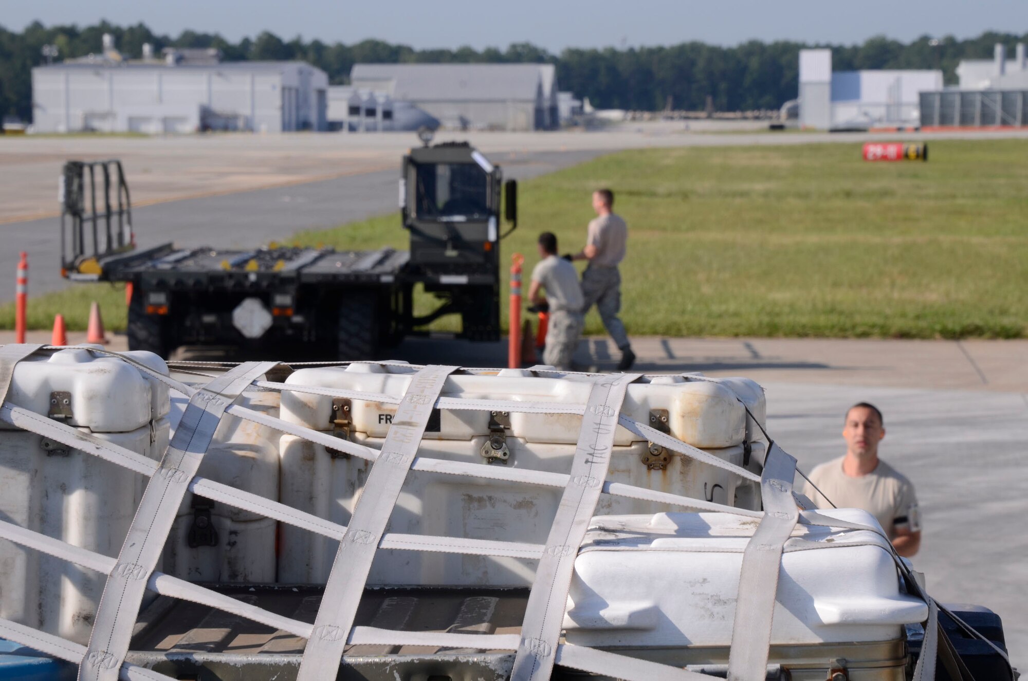 Competitors from the 80th Aerial Port Squadron scramble to take their positions as they begin the 25K event at Port Dawg Competition held at Dobbins Air Reserve Base, Ga. June 19-21. (U.S. Air Force photo/Don Peek)