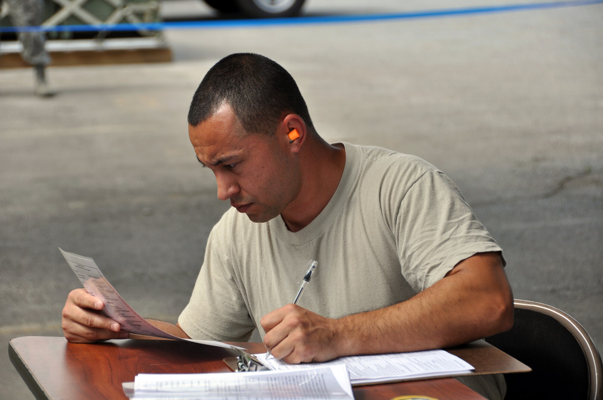 Tech. Sgt. Joseph Saldivar, of the 80th Aerial Port Squadron, checks over regulations regarding cargo standards. Teams compete in various challenges to showcase their capabilities as aerial porters. (U.S. Air Force photo/Senior Airman Elizabeth Gaston)