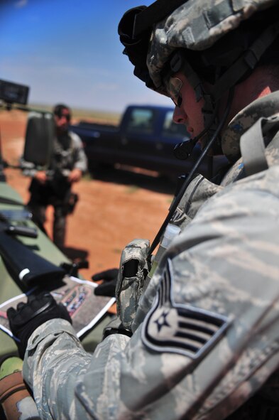 U.S. Air Force Staff Sgt. Douglas Freeman, 27th Special Operations Security Forces Squadron Deployed Aircraft Ground Response Element team, reviews a map before beginning a convoy training mission at Melrose Air Force Range, N.M., June 8, 2012. The DAGRE team is trained to adapt security missions to support Special Operations Forces worldwide. (U.S. Air Force photo by Airman 1st Class Eboni Reece)