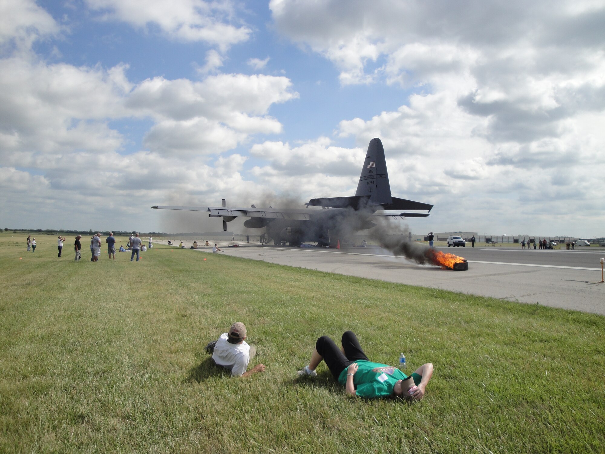 A Missouri Air National Guard C-130 aircraft from the 139th Airlift Wing is surrounded by role payers and civilian emergency responders during a major accident response exercise at Kansas City International Airport, Mo., June 20. The Wing provided a C-130 aircraft for use in the exercise. (Photo by Master Sgt. Mike R. Smith/Missouri Air Guard) (Released)