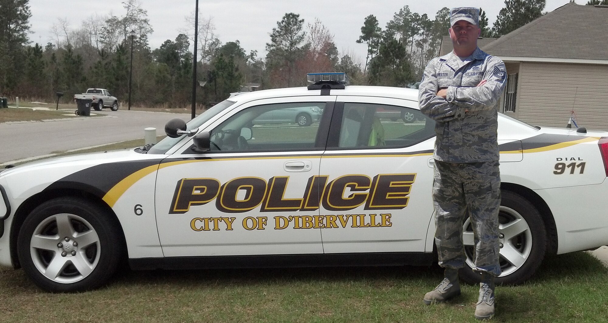 Technical Sergeant Ryan Hester stands next to his patrol car for the city of D’Iberville, Miss., where he serves as a reserve police officer. Recently, Hester put the life-saving training he learned in the Air Force to use while on patrol in his reserve police officer role. Hester is part of the 366th Training Squadron’s Detachment six which is a geographically separated unit from the 82nd Training Wing at Sheppard Air Force Base, Texas. (U.S. Air Force/Courtesy Photo)