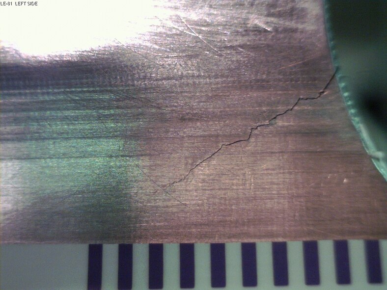 AFRL engineers are learning more about technologies that could one day detect aircraft damage in real time, detecting cracks such as the one above using sensors, (AFRL photo)