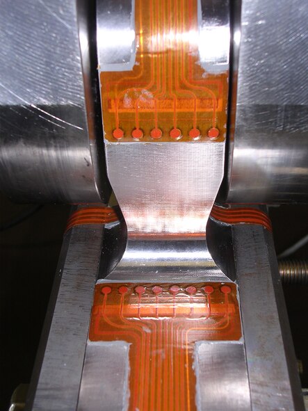 During the Rapid Structural Health Monitoring Designs for Structural Hot Spots testing, AFRL engineers used sensors such as the ones shown to detect and monitor crack growth in a test article.  Studying the ability to detect these cracks will help researchers move closer toward a fieldable Structural Health Monitoring system for real-time damage detection on aircraft. (AFRL photo)