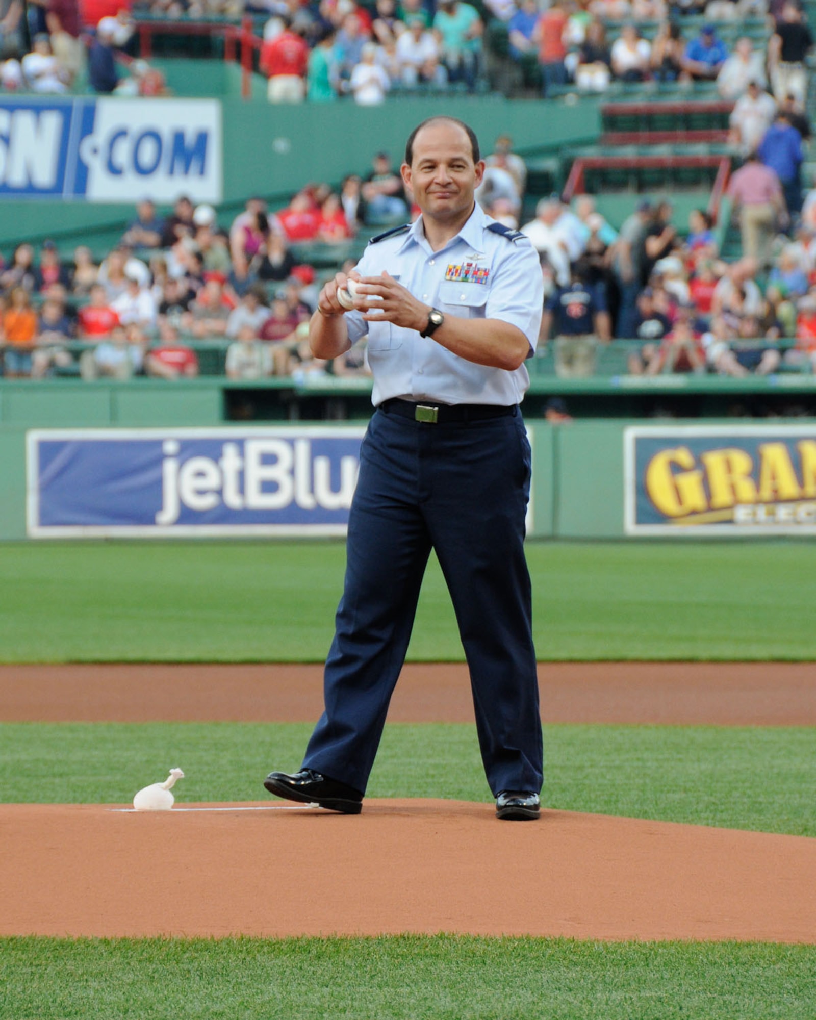 BOSTON – Col. Juan Gaud, 66th Air Base Group deputy commander, winds up for the first pitch to begin the Boston Red Sox versus Miami Marlins game at Fenway Park June 19. The Red Sox won the game 7 to 5. (U.S. Air Force photo by Linda LaBonte Britt)