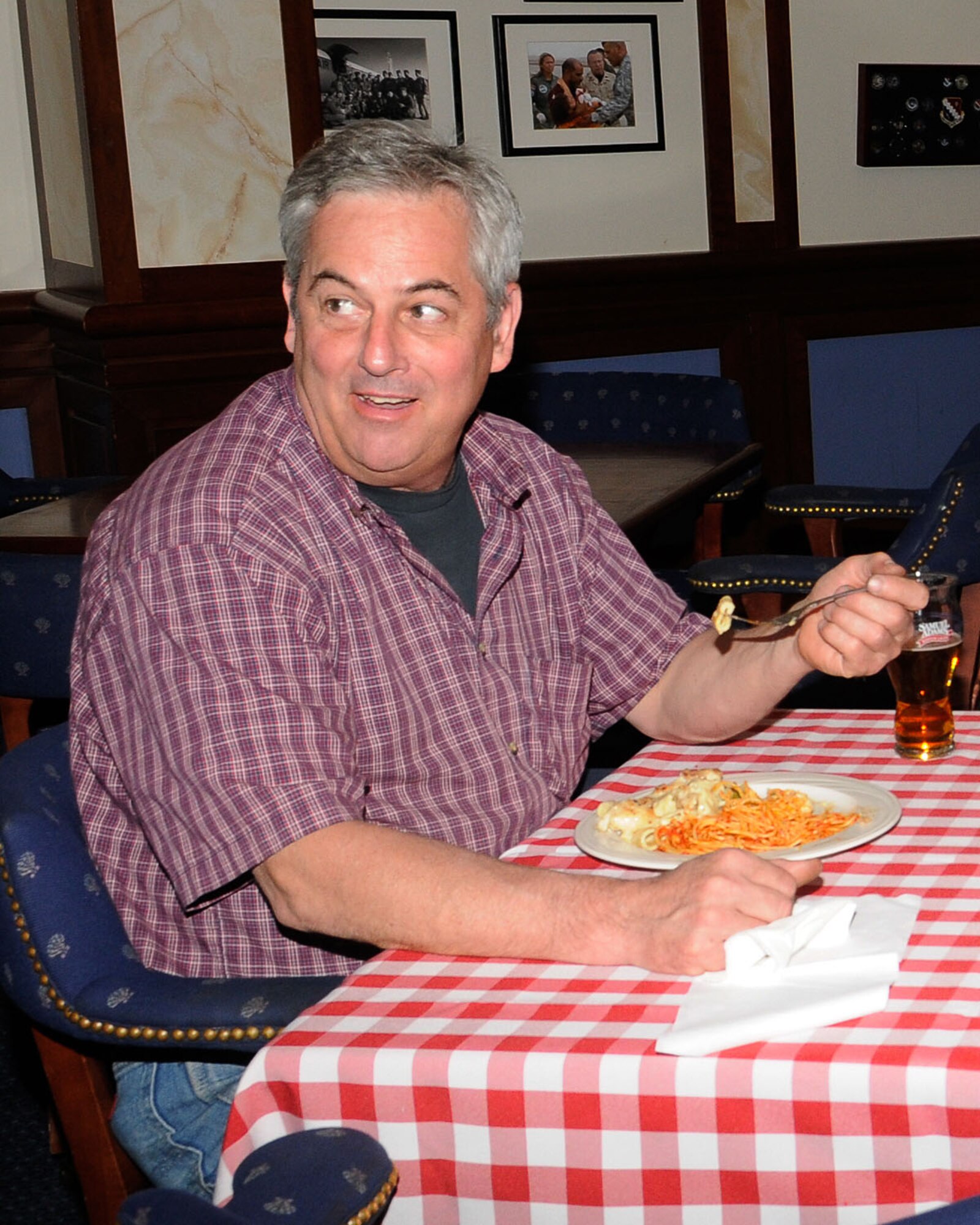 HANSCOM AIR FORCE BASE, Mass. – Joseph Signor enjoys some pasta during Pasta Night at the Minuteman Commons June 15. The Commons also holds special dinner nights such as wing specials on Wednesdays and Steak Night the last Thursday of the month. (U.S. Air Force photo by Linda LaBonte Britt)
