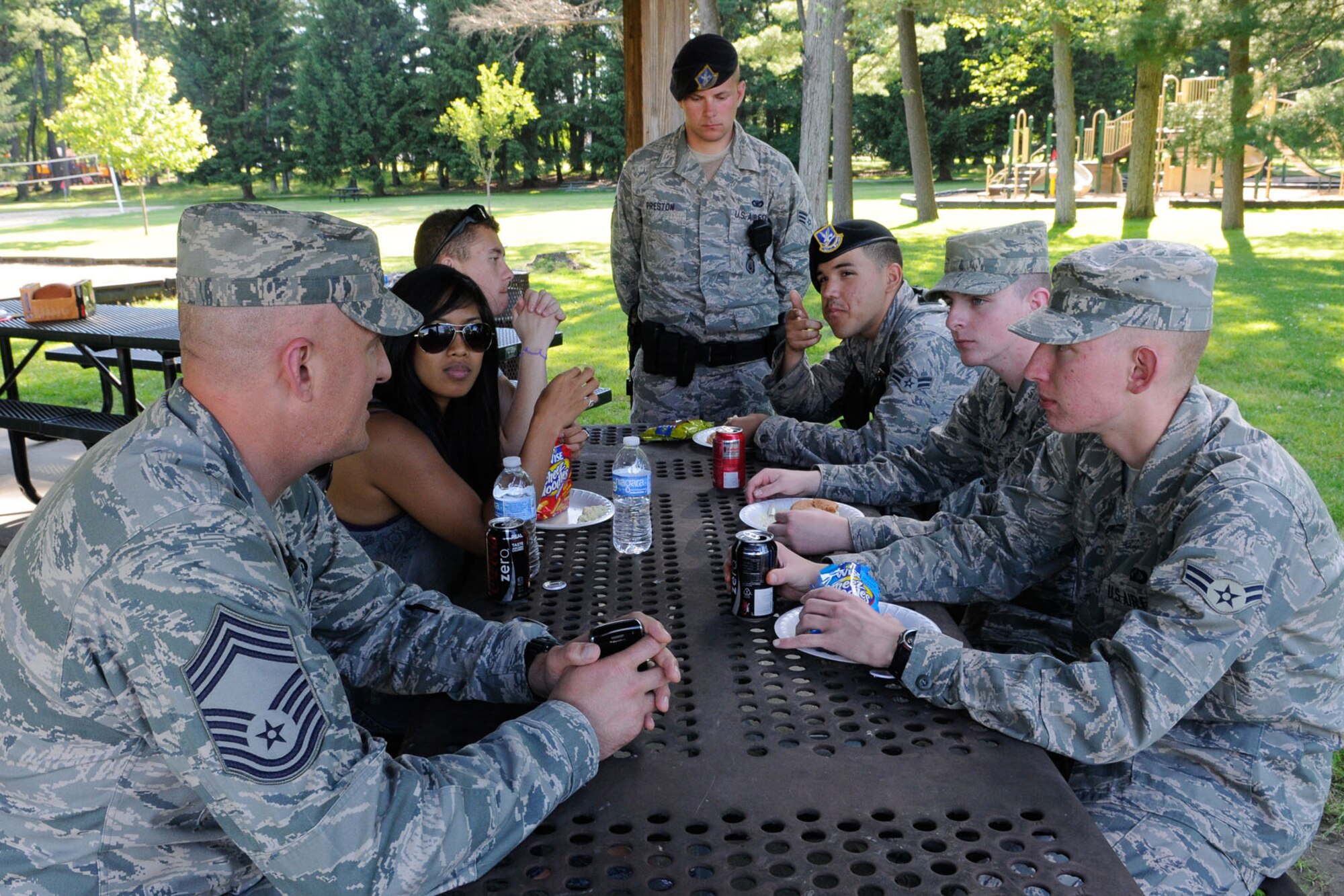 HANSCOM AIR FORCE BASE, Mass. – Chief Master Sgt. Baird Stiefel (left), 66th Air Base Group superintendant, chats with Airmen during the Single Airmen Dinner at Castle Park June 14. The dinner is a chance for junior enlisted members to enjoy a free meal and interact informally with base senior leaders. (U.S. Air Force photo by Linda LaBonte Britt)