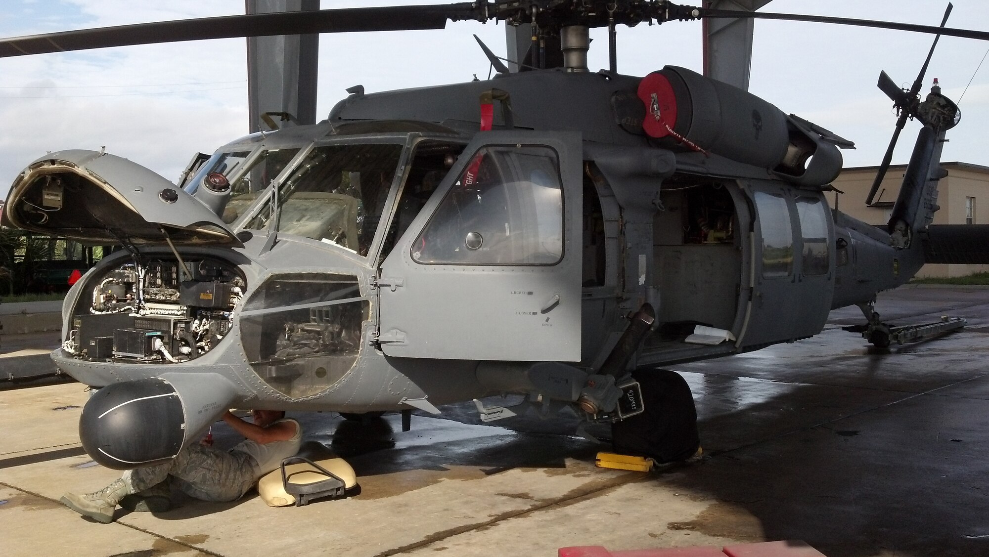 A maintenance Airman from the 920th Rescue Wing, Patrick Air Force Base, Fla., works on the avionics systems of an HH-60G Pave Hawk helicopter that recently returned from an overseas deployment to Afghanistan. Rescue Wing Airmen were deployed to Camp Bastion providing combat search and rescue. During the year-long effort, they performed more than 800 rescues. (U.S. Air Force photo/Capt. Cathleen Snow)