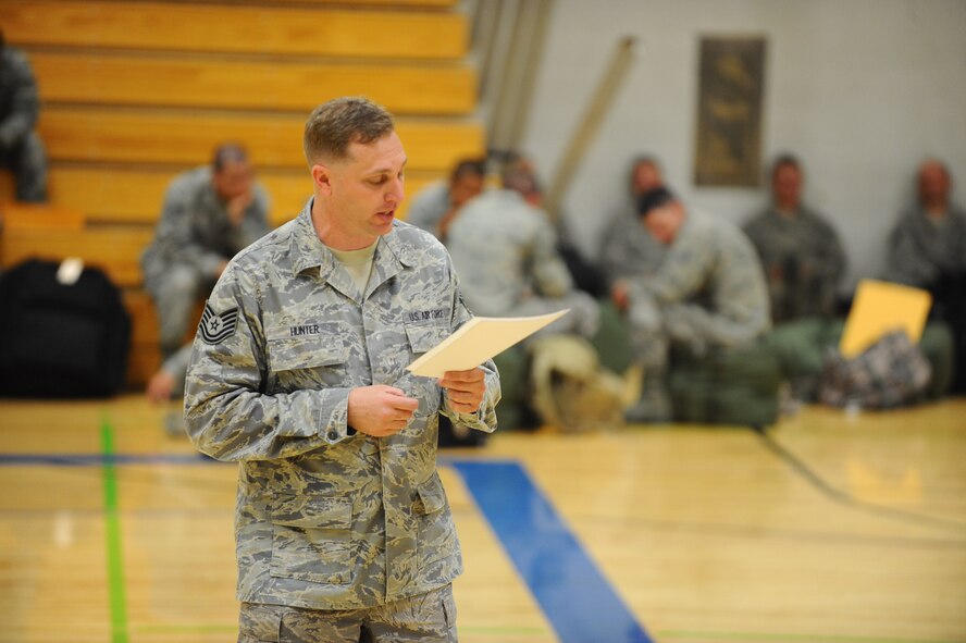 Tech Sgt. Coyd Hunter, 28th Logistics Readiness Squadron wing assembly area NCO in charge, provides Airmen with a pre-exercise briefing at the Bellamy Fitness Center during an Operational Readiness Exercise at Ellsworth Air Force Base, S.D., June 15, 2012. The ORE was designed to test all of the processes at the base’s new deployment center while preparing Airmen to deploy in support of world-wide operations. (U.S. Air Force photo by Airman 1st Class Zachary Hada/Released)